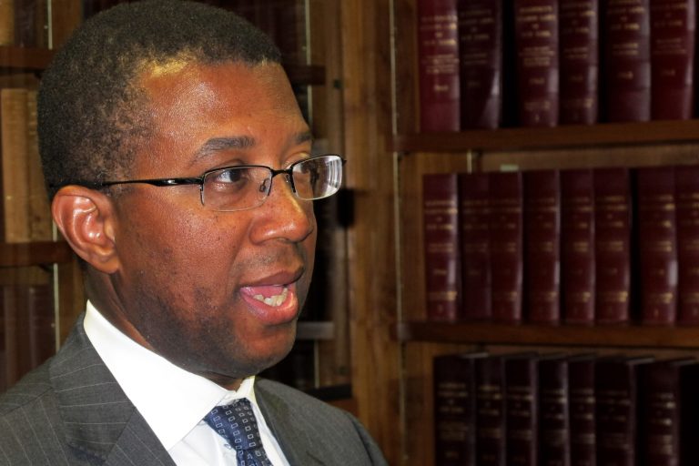 Federal monitor James Johnson discusses a report on Westchester County zoning laws in White Plains, N.Y., on Wednesday, Sept. 10, 2014. Johnson's report found that six towns and villages have laws that may violate  federal standards.. (AP Photo/Jim Fitzgerald).