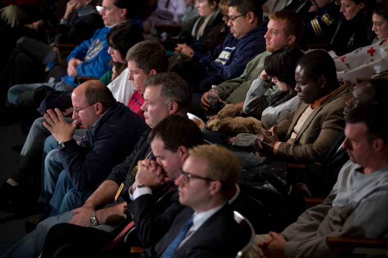   Residents pray during an interfaith vigil for the victims of the Sandy Hook Elementary School shooting on Sunday, Dec. 16, 2012, at Newtown High School in Newtown, Conn. A gunman walked into the elementary school Friday and opened fire, killing 26 people, including 20 children. (AP Photo/ Evan Vucci)  