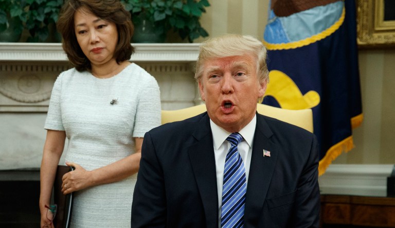 President Trump told some aggressive reporters to calm down on Friday after they apparently hit a table. (AP Photo/Evan Vucci)