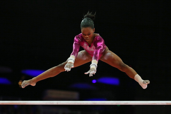 Gabrielle Douglas competes on the uneven bars in the all-around final. (Getty Images)