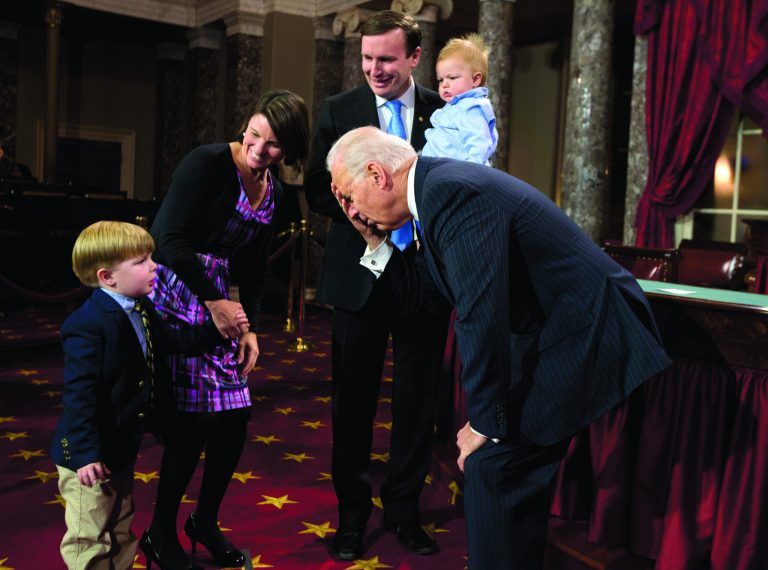 Vice President Joe Biden, center, jokes around with Owen Murphy, son of Sen. Chris Murphy, D-Conn., second from right, before a mock swearing-in ceremony for the 113th Congress, Thursday, Jan. 3, 2013, in the Old Senate Chamber on Capitol Hill in Washington. From left are Owen; Murphy's wife Catherine Murphy, Biden, Murphy, and son Rider. (AP Photo/ Evan Vucci)