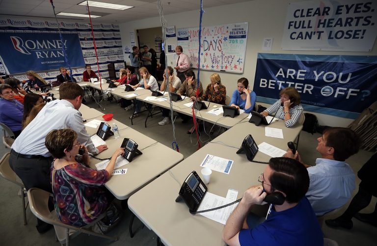 Volunteers make phone calls seeking support for Republican presidential candidate Mitt Romney at his Arlington Victory Center. (Getty Images)