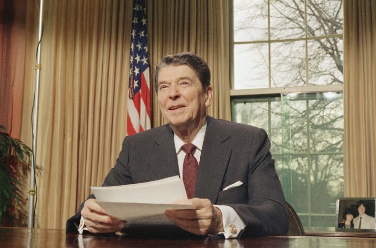 Then-President Ronald Reagan speaks from his White House office in January 1987. (AP Photo/Dennis Cook)