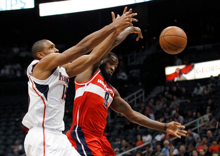  Atlanta Hawks center Al Horford (15) has the ball knocked away by Washington Wizards forward Martell Webster (9) in the first half of an NBA basketball game Friday, Dec. 7, 2012 in Atlanta. (AP Photo/John Bazemore)  