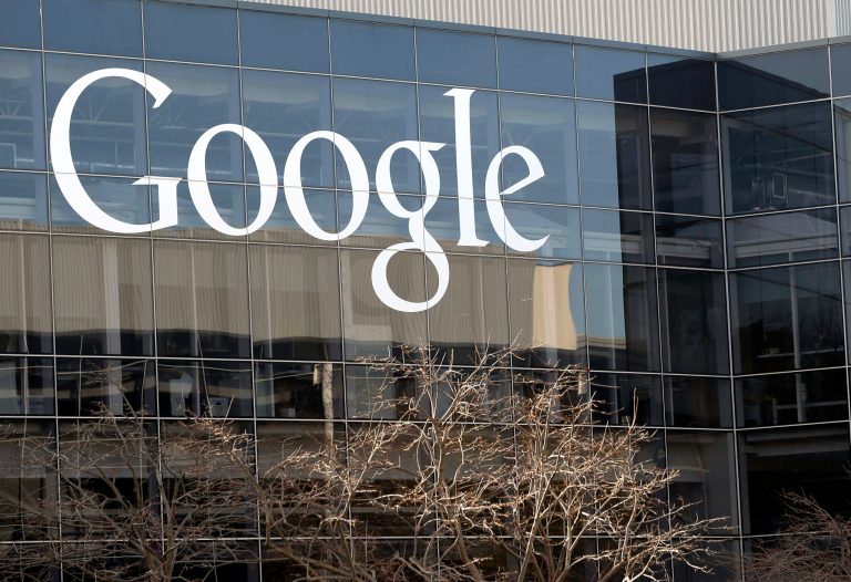 FILE - This Jan. 3, 2013, file photo shows a Google sign at the company's headquarters in Mountain View, Calif. When it comes to the Internet, the Obama administration appears simultaneously to be a bungling amateur and a stealthy wizard. The same federal government that apparently intercepted communications to and from Google and Yahoo data centers without leaving a trace is facing scorn because it can't put together a working website for health care. (AP Photo/Marcio Jose Sanchez, File)