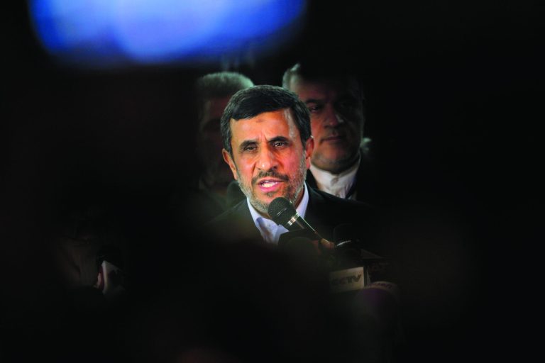 Iran's President Mahmoud Ahmadinejad, center, talks during a presser following his meeting with Grand Sheik Ahmed al-Tayeb, the head of Al-Azhar, the Sunni Muslim world's premier Islamic institution, not pictured, at Al Azhar headquarters in Cairo, Egypt, Tuesday, Feb. 5, 2013. Egypt's most prominent Muslim cleric, the sheik of Al-Azhar, has warned Iranian President Mahmoud Ahmadinejad against interfering in Arab Gulf countries or trying to spread Shiite influence. Ahmadinejad, on a landmark visit to Egypt on Tuesday, received an uneasy reception from Ahmed el-Tayeb at Al-Azhar, the Sunni Muslim world's foremost Islamic institution.(AP Photo/Amr Nabil)