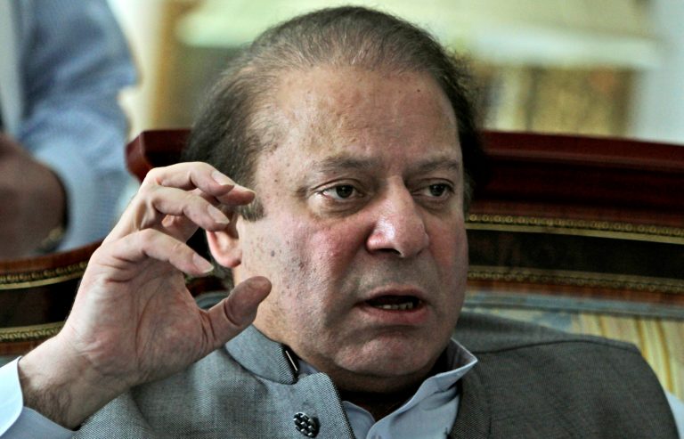 FILE - In this Monday, May 13, 2013 file photo, former prime minister and leader of Pakistan Muslim League-N party, Nawaz Sharif, gestures while speaking to members of the media at his residence in Lahore, Pakistan. Over a decade ago, the man now set to become Pakistan's next prime minister stood at this border crossing with archenemy India to inaugurate a 