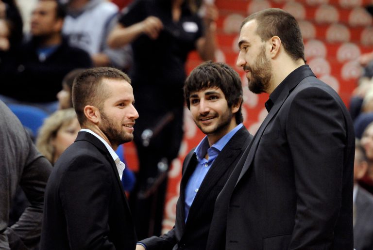   ADVANCE FOR WEEKEND EDITIONS, DEC. 8-9 - FILE - In this Nov. 14, 2012, file photo, injured Minnesota Timberwolves players, from left, J.J. Barea, Ricky Rubio of Spain, and Nikola Pekovic of Montenegro, chat before an NBA basketball game against the Charlotte Bobcats in Minneapolis. Thanks to a renewed focus overseas from David Kahn and top international scout Pete Philo, suddenly Minnesota is becoming a destination site for some of the top talent in the world. (AP Photo/Jim Mone)  