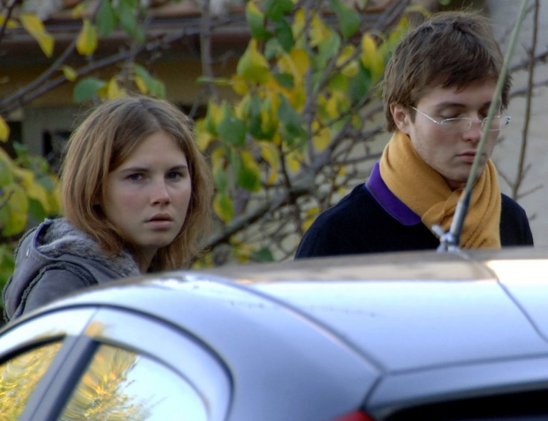 FILE - In this Friday, Nov. 2, 2007 file photo, Amanda Knox, left, and Raffaele Sollecito, are seen outside the rented house where 21-year-old British student Meredith Kercher was found dead in Perugia, Italy. Defense lawyers for U.S. student Amanda Knox and her Italian former boyfriend will get their final say on Monday, Jan. 20, 2014 in the defendants' third trial for the gruesome 2007 murder of Knox's British roommate. (AP Photo/Stefano Medici, File)
