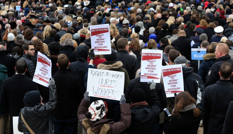 Activists turned in more than 310,000 signatures calling for a ballot referendum on whether the state should keep the right-to-work law it adopted this year. (AP Photo/Orlin Wagner)