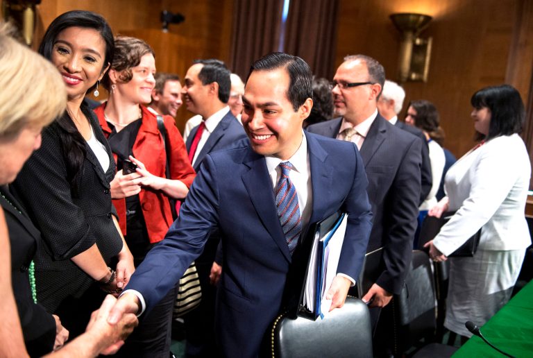 San Antonio Mayor Julian Castro greets guests after a Senate Banking, Housing and Urban Affairs Committee hearing. (CQ Roll Call via AP Images)