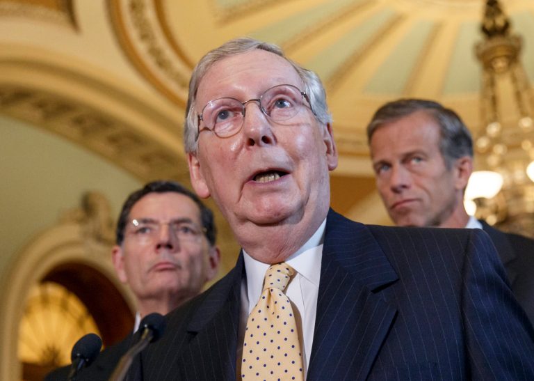 Senate Minority Leader Mitch McConnell, R-Ky.'s, center,Â released an ad Tuesday that once again ties his Democratic challenger, Secretary of State of Alison Lundergan Grimes, to President Obama, a deeply unpopular figure in the Bluegrass State.Â (AP Photo/J. Scott Applewhite)