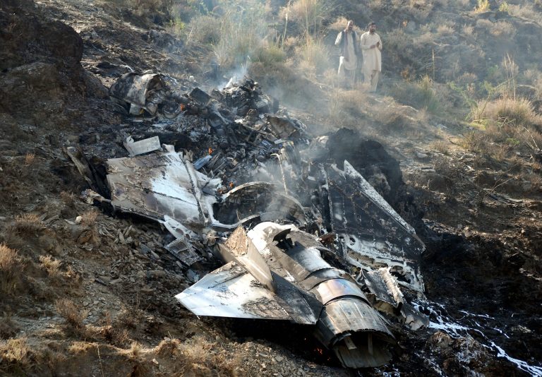   FILE - In this Nov. 14, 2011, file photo, villagers stand near wreckage of a Pakistani air force fighter jet that crashed in Attock near Islamabad, Pakistan. Over a dozen Pakistani air force planes have crashed in roughly the past 18 months, raising concerns about the health of an aging fleet that officials are struggling to upgrade because of a lack of funds. A significant number of the air forceâs combat aircraft are nearly half a century old and have been called on in recent years to help the army fight a domestic Taliban insurgency that has killed thousands of people. This has added to the strain on a force that has historically focused on countering the threat from Pakistanâs neighbor and archenemy, India. (AP Photo/Ghulam Shabbir, File)  