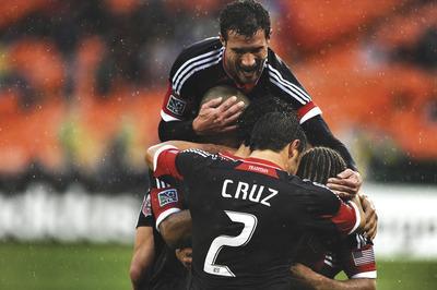 Patrick Smith/Getty Images
Chris Pontius, top, scored three times Sunday for D.C. United, which routed the New York Red Bulls to extend its unbeaten streak to six games, its longest since 2009.