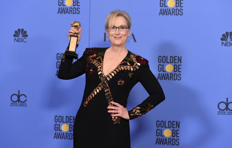 Meryl Streep poses in the press room with the Cecil B. DeMille award at the 74th annual Golden Globe Awards Jan. 8, 2017, where she called out President Trump. (Photo by Jordan Strauss/Invision/AP)