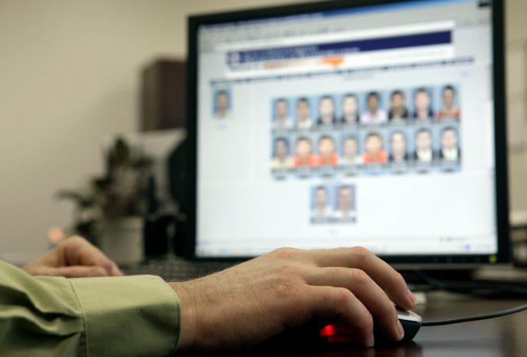 The photos can be taken from people's driver's licenses, mug shots, visa applications and passports. (AP Photo/Gerry Broome)