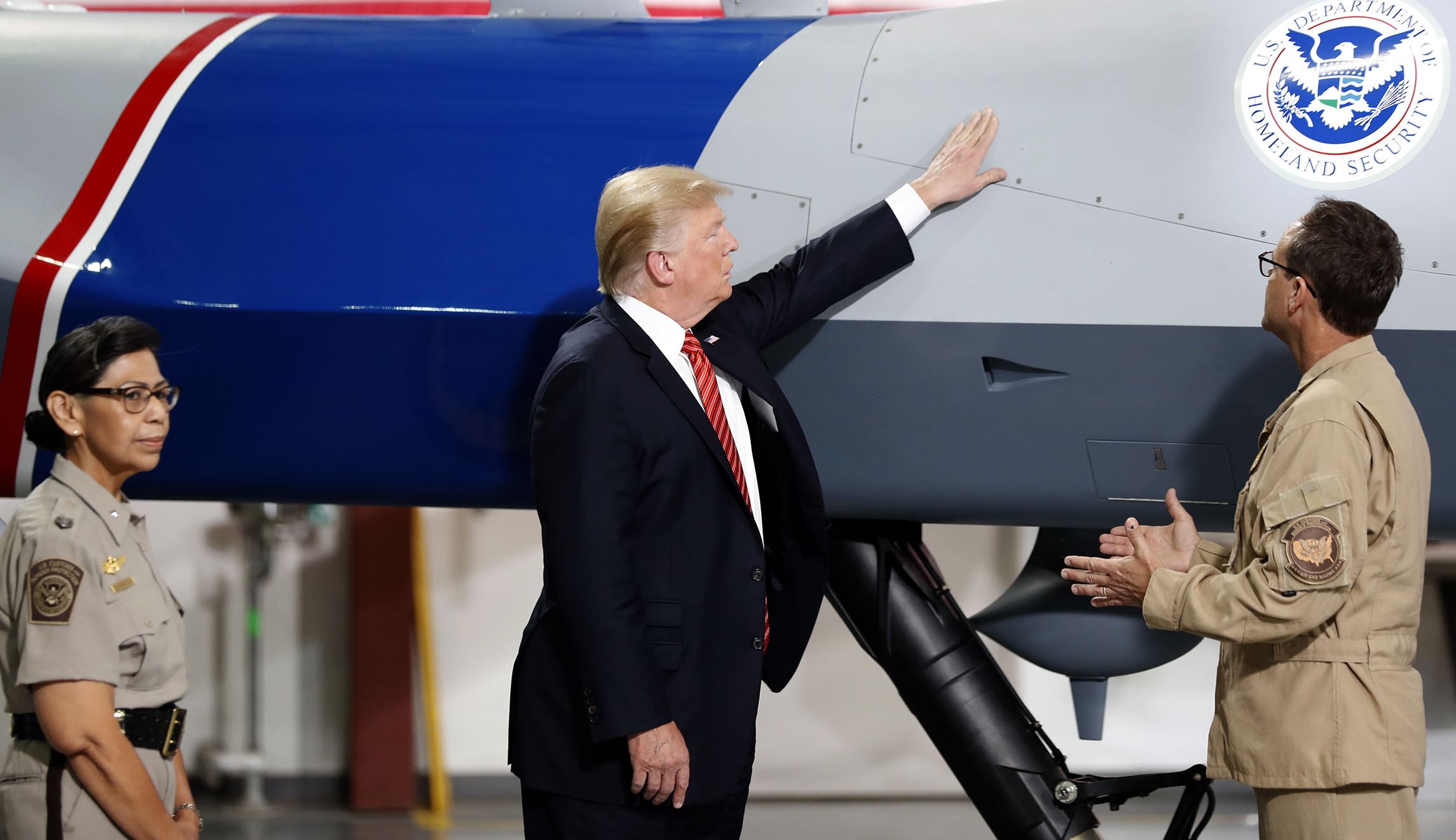 Trump pets drone in first-ever tour of Border Patrol station