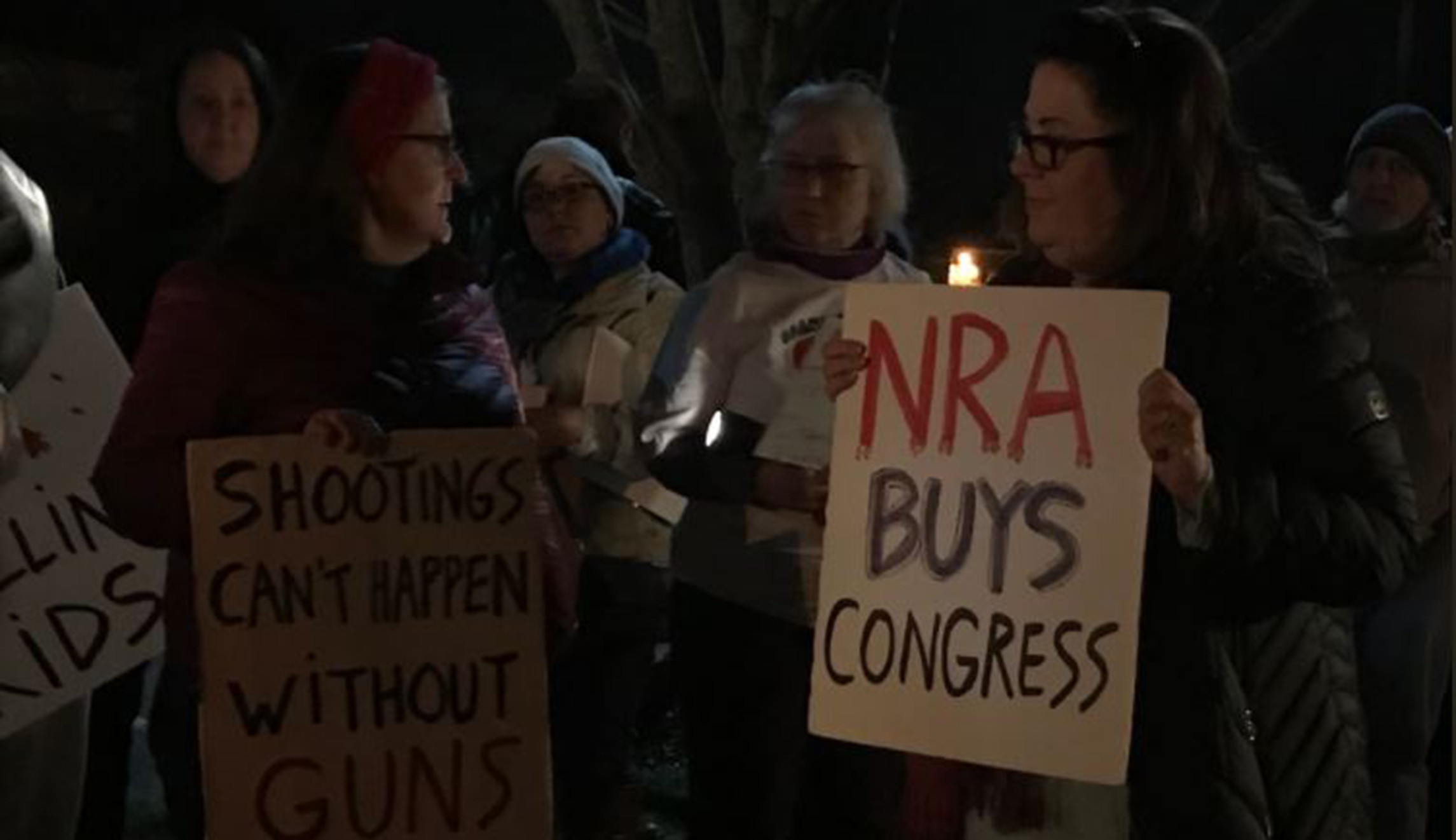 Protesters rally outside NRA headquarters after Florida shooting