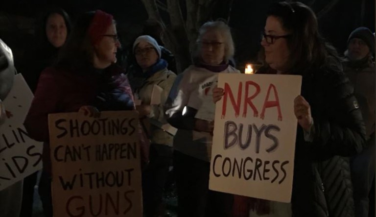 On Friday evening, a protest was held in front of the National Rifle Association's headquarters in Fairfax, Va., in response to the Wednesday school shooting in Lakeland, Fla., where 17 people were killed. (Screenshot via Anna-Lysa Gayle / Twitter)