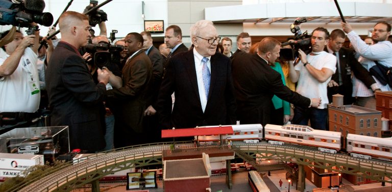   FILE - In this Saturday, May 1, 2010, file photo, Berkshire Hathaway Chairman and CEO Warren Buffett surveys a model railroad prior to participating in the annual shareholders meeting, in Omaha, Neb. Warren Buffett's company announced Wednesday, Dec. 26, 2012, that it has sold two short-line railroads it recently discovered it owned to satisfy regulators who might have reviewed Berkshire Hathaway's 2010 acquisition of the Burlington Northern Santa Fe railroad. (AP Photo/Nati Harnik, File)  