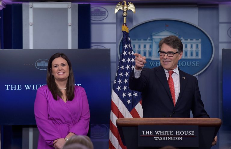 Energy Secretary Rick Perry, right, calls on a reporter as he stands next to White House deputy press secretary Sarah Huckabee Sanders, left, during the daily briefing at the White House in Washington, Tuesday, June 27, 2017. (AP Photo/Susan Walsh)