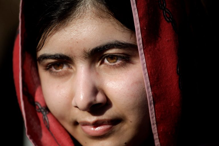 FILE - In this Feb. 18, 2014 file photo, Malala Yousafzai, visits Zaatari refugee camp near the Syrian border in Mafraq, Jordan. Children's rights activists Yousafzai, 17, of Pakistan and Kailash Satyarthi of India were awarded the Nobel Peace Prize Friday, Oct. 10, 2014. (AP Photo/Mohammad Hannon, File)