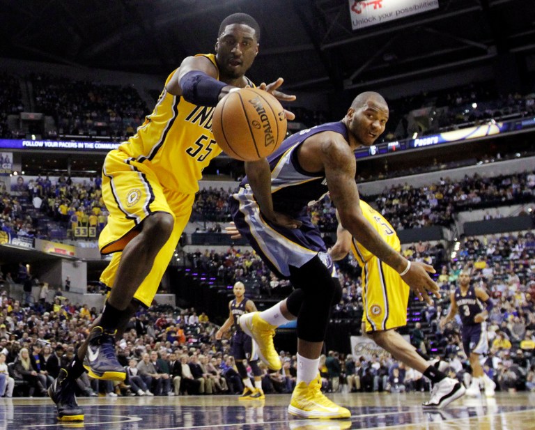   Indiana Pacers' Roy Hibbert (55) battles Memphis Grizzlies' Marreese Speights (5) for a loose ball during the first half of an NBA basketball game, Monday, Dec. 31, 2012, in Indianapolis. (AP Photo/Darron Cummings)  