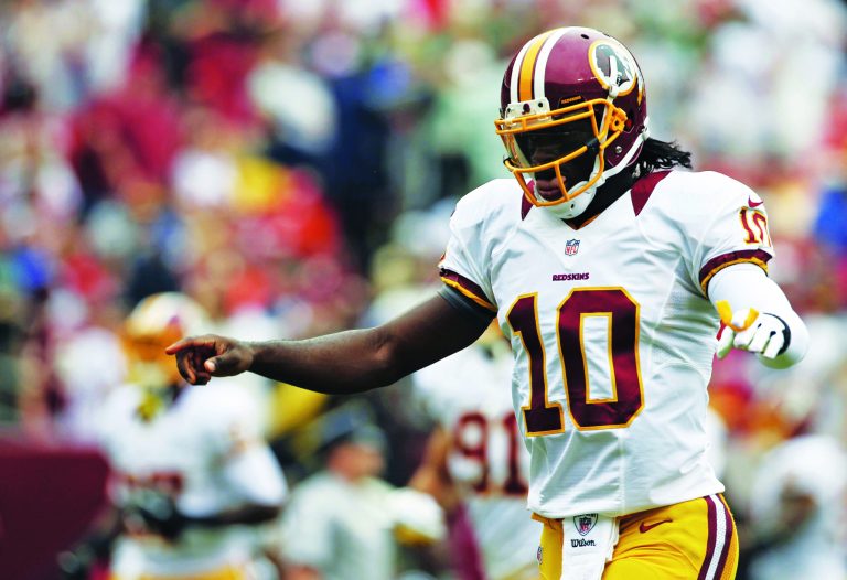 A decade ago, rookie quarterbacks were brought along slowly, but Robert Griffin III was named the Washington Redskins' starter immediately. (AP photo)
