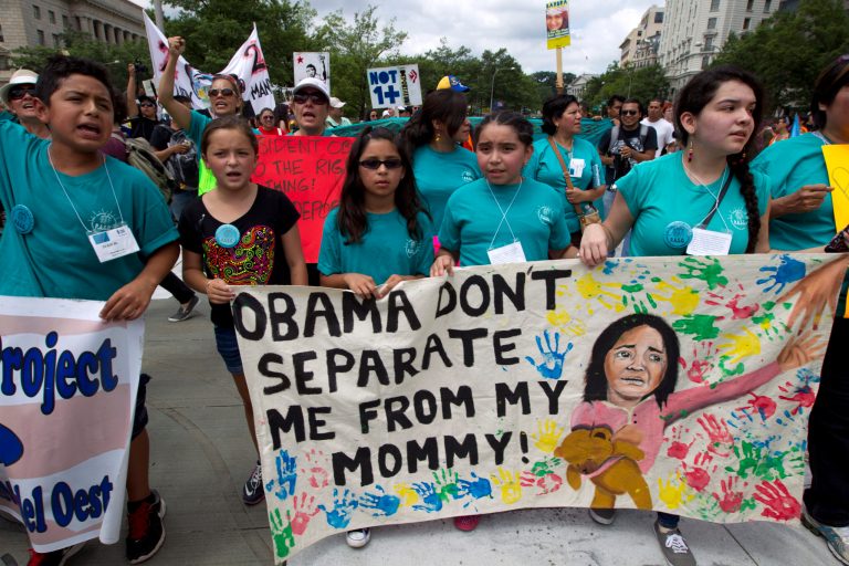 This Saturday, Aug. 2, 2014, photo shows demonstrators as they march at Freedom Plaza in Washington, asking President Obama to modify deportation policies. (AP Photo/Jose Luis Magana)