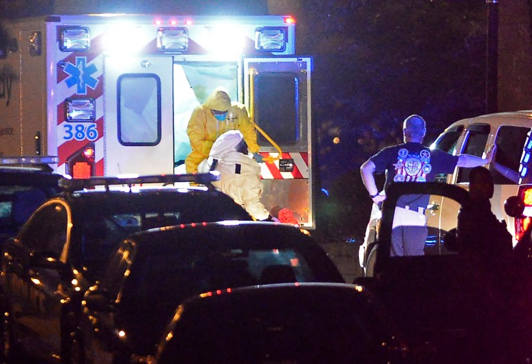 An ambulance carrying Amber Joy Vinson, the second healthcare worker to be diagnosed with Ebola in Texas, arrives at Emory University Hospital on Wednesday, Oct. 15, 2014, in Atlanta. (AP Photo/David Tulis)