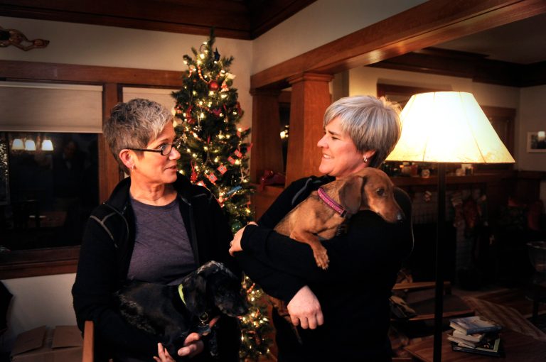   Former Army Major Margaret Witt, right, and Lori Johnson, left, stand in their south hill home, Monday, Dec. 3, 2012 in Spokane, Wash. They are planning to marry in a few weeks after receiving one of the first marriage licenses for same sex couples this week. Witt fought the Army over 