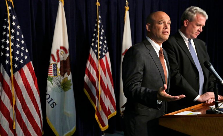 Illinois State Rep. Ron Sandack, R-Downer's Grove,left, and House Republican Leader Jim Durkin, R-Western Springs, speak at a news conference Thursday, July 10, 2015, in Chicago. Republican members of a legislative panel including Sandack, that are probing Gov. Pat Quinn's troubled anti-violence program say they'll continue with proceedings next week even after a U.S. Department of Justice request to hold off. This year, an audit blasted Quinn's 2010 Neighborhood Recovery Initiative. Commission members say the audit left unanswered questions and subpoenaed former Quinn aides to testify next week. (AP Photo/M. Spencer Green)