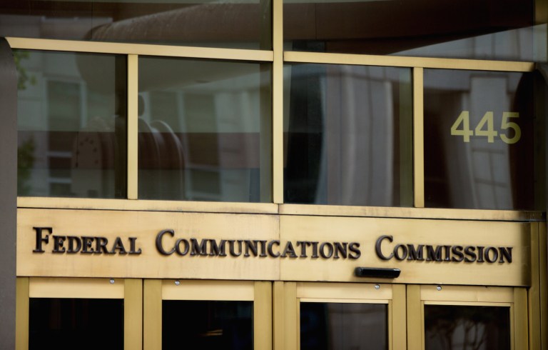 In the photo taken June 19, 2015, the entrance to the Federal Communications Commission (FCC) building in Washington. The government's latest push to make sure consumers get equal access to the Internet faced a key legal test Friday as a federal appeals court considered whether to treat high-speed service providers as though they are public utilities. But two judges hearing more than three hours of technical arguments in the case seemed at times sympathetic to government attorneys arguing that the FCC was within its authority when it approved "net neutrality" rules in February.