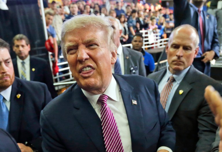 A Florida judge ordered Friday that Donald Trump pay $282,000 in attorney fees to a Doral, Fla., paint shop that sued the Republican nominee for unpaid bills. (AP Photo/Steve Helber)