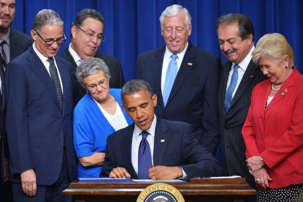 US President Barack Obama signs the reauthorization of the Export-Import Bank in May. The reauthorization of the bank comes after conservatives in Congress challenged its role. (Getty Images)