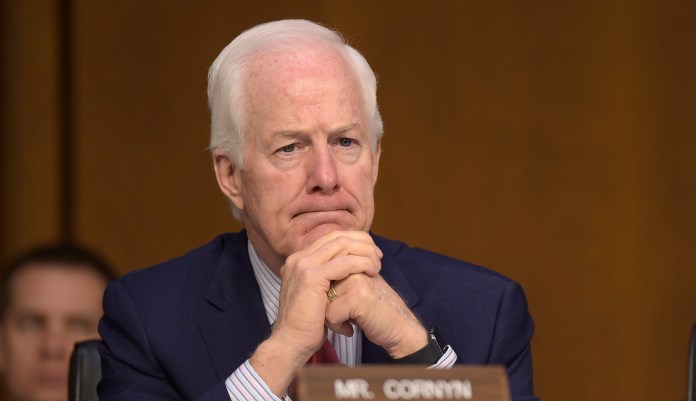 "This critically important information from the suspect's criminal history was not uploaded into the relevant background check databases, even though a federal law clearly requires that it be done," Cornyn said. (AP Photo/Susan Walsh)