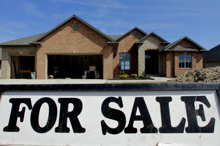 In this May 23 file photo, a new home still under construction is seen for sale in Springfield, Ill. (AP Photo/Seth Perlman)