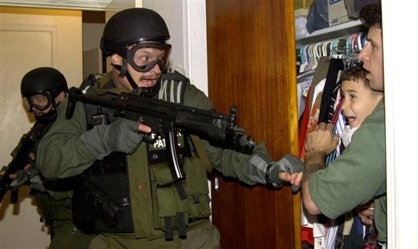 Holder keeps a Janet Reno portrait in his office