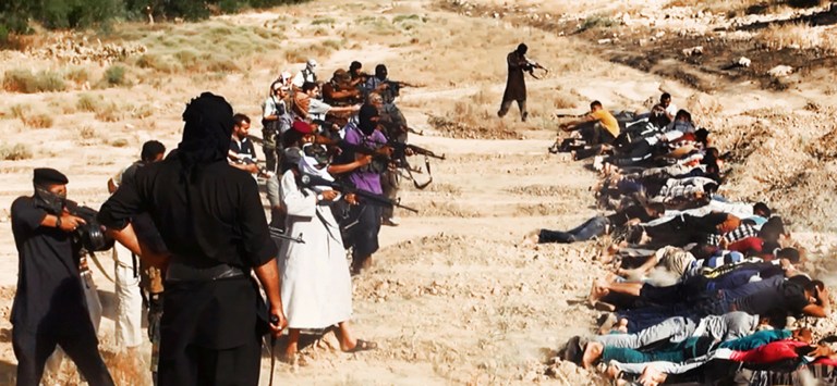 FILE - This file image posted on a militant website on Saturday, June 14, 2014, which has been verified and is consistent with other AP reporting, appears to show militants from the al-Qaida-inspired Islamic State of Iraq and the Levant (ISIL) taking aim at captured Iraqi soldiers wearing plain clothes after taking over a base in Tikrit, Iraq. Iraqi insurgents executed at least 160 captives earlier this month in the northern city of Tikrit, Human Rights Watch said Friday, June 27, 2014, citing an analysis of satellite imagery and grisly photos released by the militants. The U.S.-based rights group said militants from the Islamic State of Iraq and the Levant killed between 160 and 190 men in two locations in Tikrit between June 11 and June 14. 