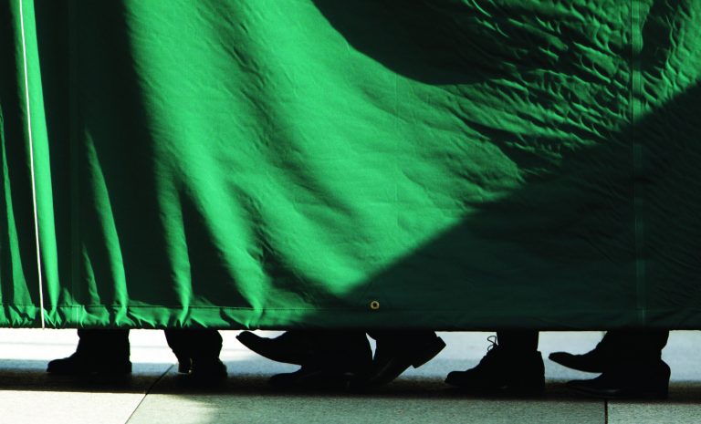 Feet are seen passing through the tarp covered walkway, for security, to the Blair House in Washington, Tuesday, Jan. 8, 2013, as the Afghan delegation headed by the Afghan President Hamid Karzai arrives. President Barack Obama will host Afghan President Hamid Karzai and his delegation at the White House for bilateral meetings on Friday, Jan. 11. (AP Photo/Manuel Balce Ceneta)