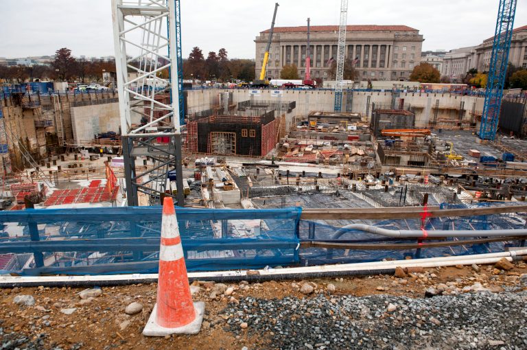 FILE - This Nov. 17, 2013 file photo shows construction continuing on the National Museum of African American History and Culture in Washington. A budget deal approved by Congress restores funding for some national arts and cultural programs, but others will still see reductions. In a funding bill approved this week, lawmakers decided against providing construction money for the planned Dwight D. Eisenhower memorial in Washington. The deal provides $1 million for salaries and expenses of the federal memorial commission, dismissing its $51 million budget request.  (AP Photo/Cliff Owen, File)