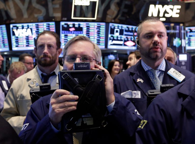 Traders work on the floor of the New York Stock Exchange. (AP/Richard Drew)