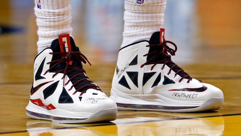   Miami Heat's LeBron James (6) remembers the victims of the mass shooting in Newtown, Conn., during an NBA basketball game against the Washington Wizards in Miami, Saturday, Dec 15, 2012. (AP Photo/Alan Diaz)  