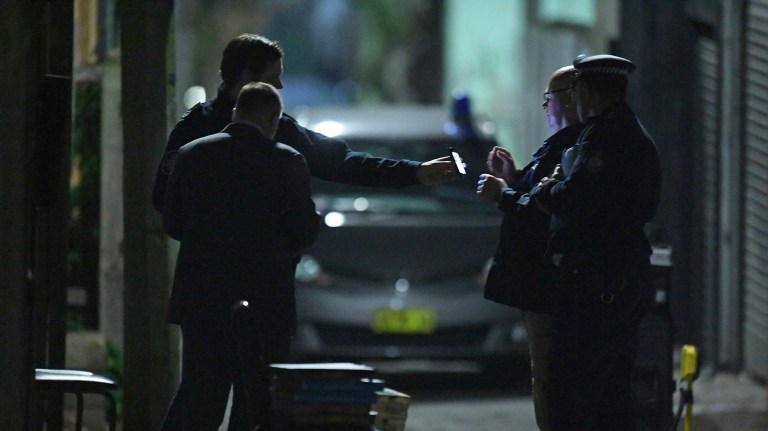 Australian Federal Police and NSW Police officers work in the Surry Hills suburb of Sydney, Australia on Saturday. (Sam Mooy/AAP Image via AP)