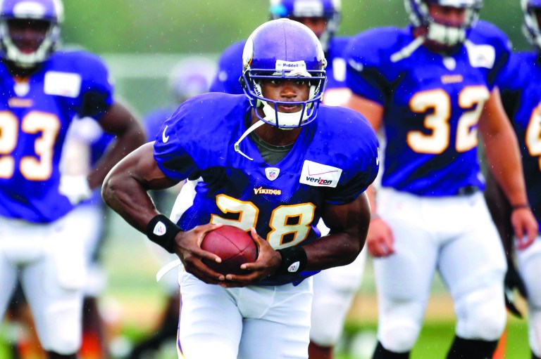 Jerry Holt/The Star Tribune/AP
Minnesota Vikings running back Adrian Peterson is coming back from an ACL injury.