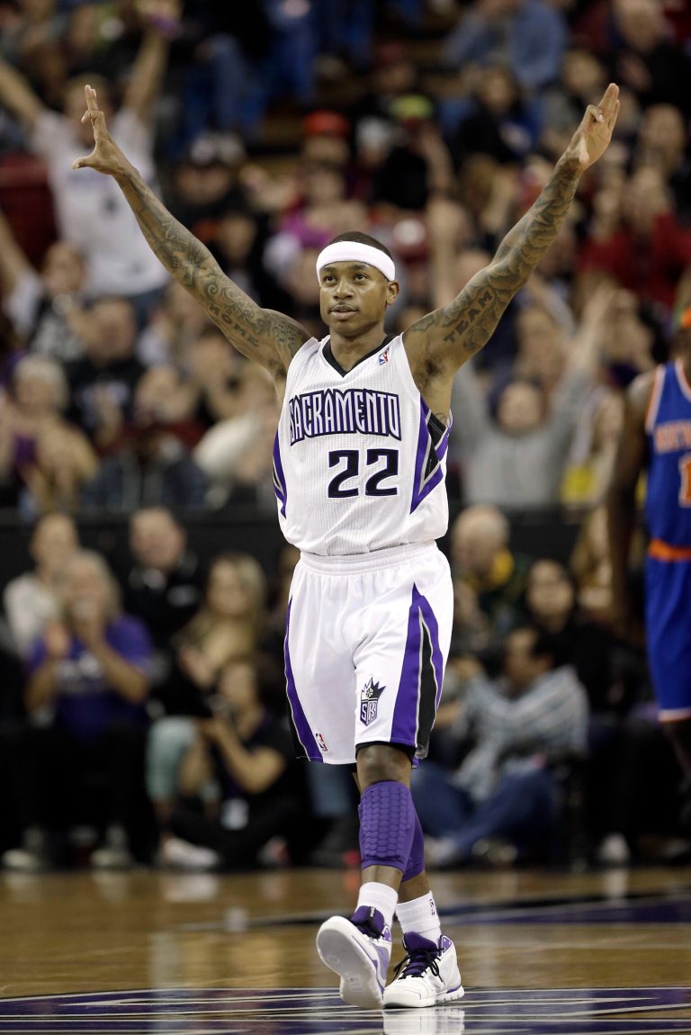   Sacramento Kings Isaiah Thomas celebrates after scoring the second of back-to-back three point shots against the New York Knicks during the first quarter of an NBA basketball game in Sacramento, Calif., Friday, Dec. 28, 2012.(AP Photo/Rich Pedroncelli)  