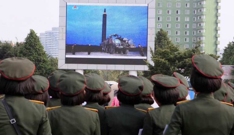 People fill the square of the main railway station to watch a televised news broadcast of the test-fire of an inter-continental ballistic rocket Hwasong-12, Wednesday, August 30, 2017, in Pyongyang, North Korea. (AP Photo/Kim Kwang Hyon)