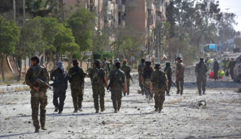 Syrian Kurdish-led forces say they are carrying out mine-clearing operations at the country's largest dam and the nearby town of Tabqa a day after seizing them from Islamic State militants. (Hawar News Agency, via AP)