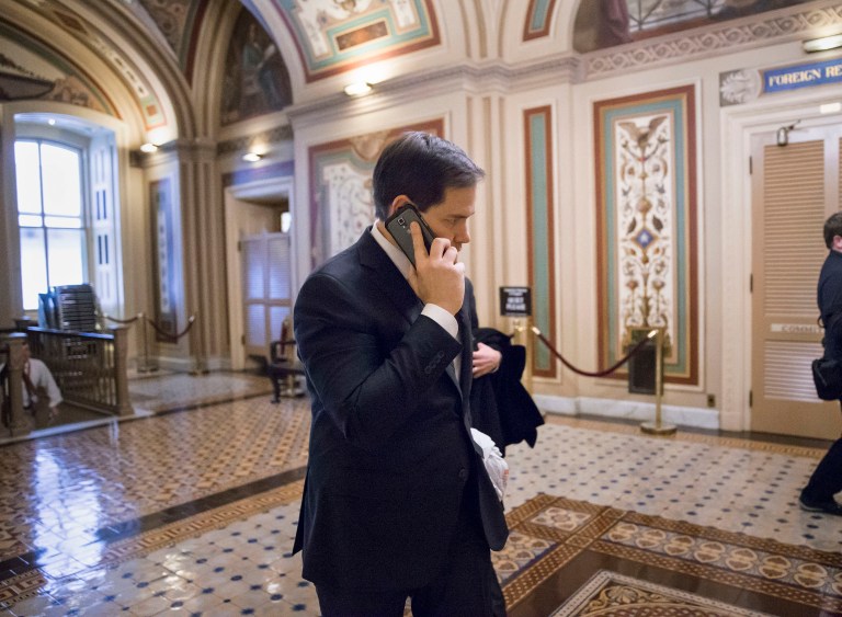 Marco Rubio, who suspended his presidential bid on Tuesday night, met briefly with reporters after a warm reception from fellow GOP senators at a private GOP lunch in the Capitol. (AP Photo/J. Scott Applewhite)
