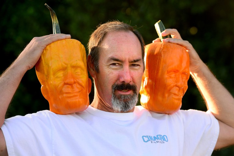 Tony Dighera holds a couple of his Frankenstein pumpkins he grows at his farm, Cinagro Farms in Fillmore. Friday, Sept. 26, 2014. His Frankenstein pumpkins are for sale at Whole Foods and Gelsons. (AP Photo/Los Angeles Daily News, Michael Owen Baker)